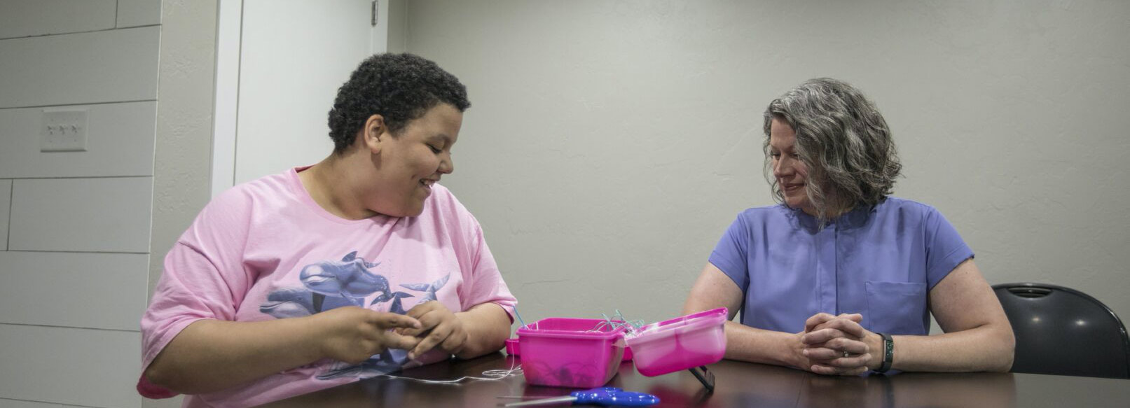 A covey client making a bracelet.